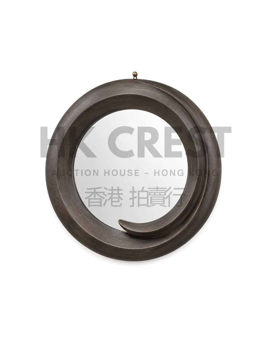 Round wall mirror framed in dark stained ash with a broad bevelled profile and discreet…