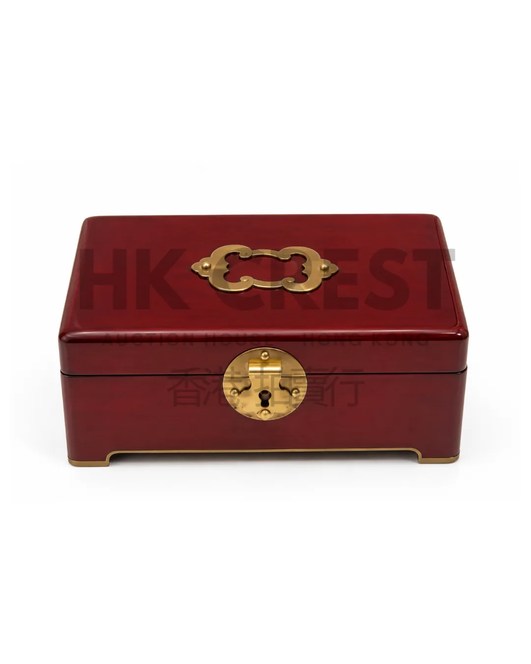 Rectangular lacquer box in deep oxblood red with a flush-fitting lid and minimal brass…