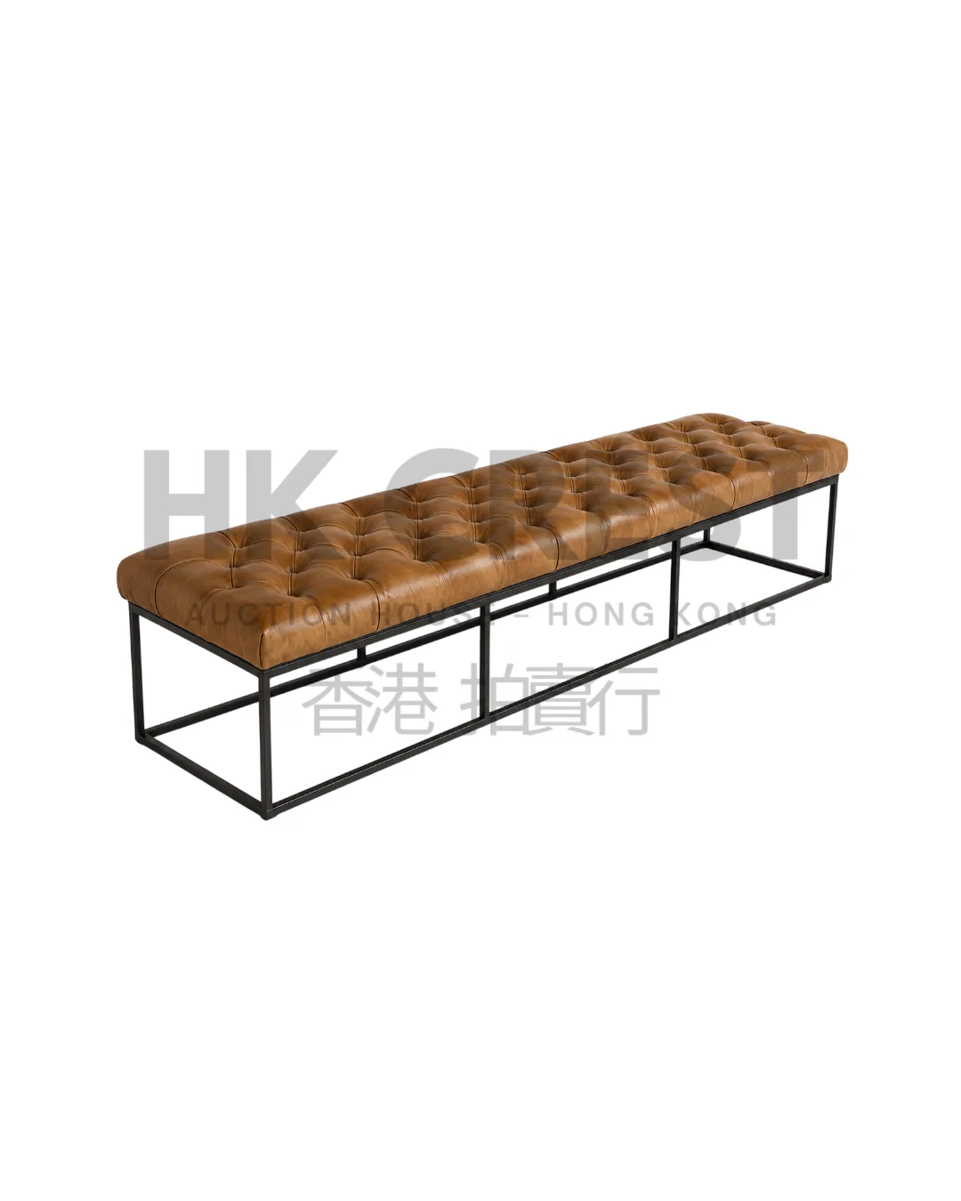 Upholstered bench with a long camel-coloured leather cushion on a blackened steel sled…
