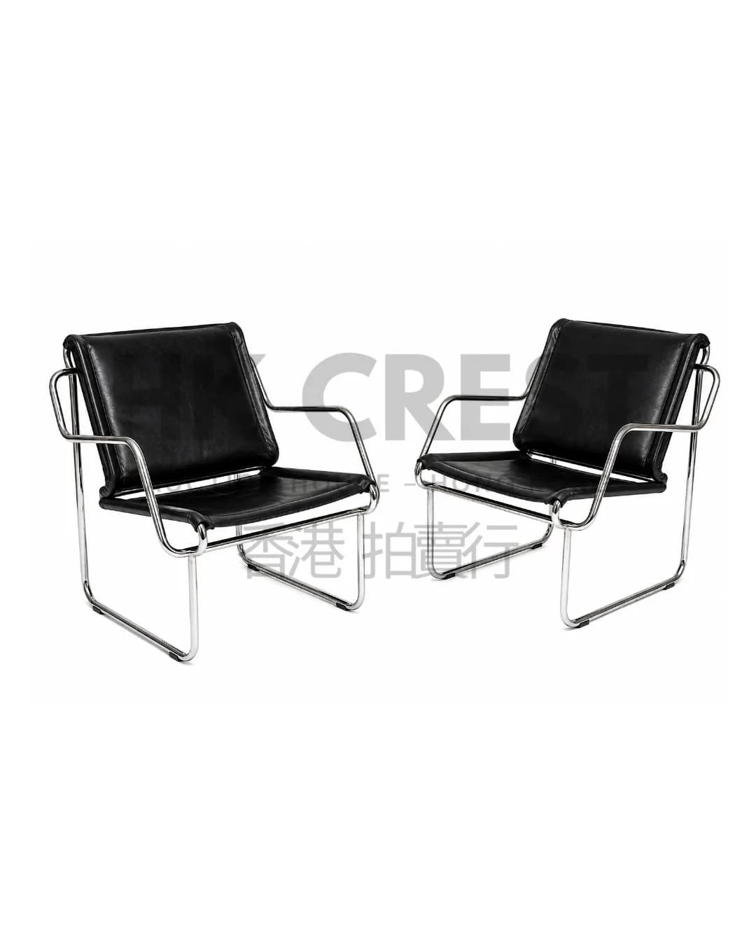 Pair of chrome tubular lounge chairs with cantilever frames and loose black leather…