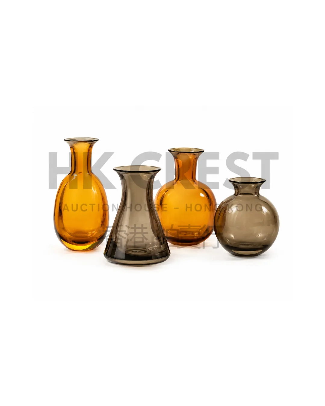Set of four small hand-blown glass vessels in amber and smoke tones