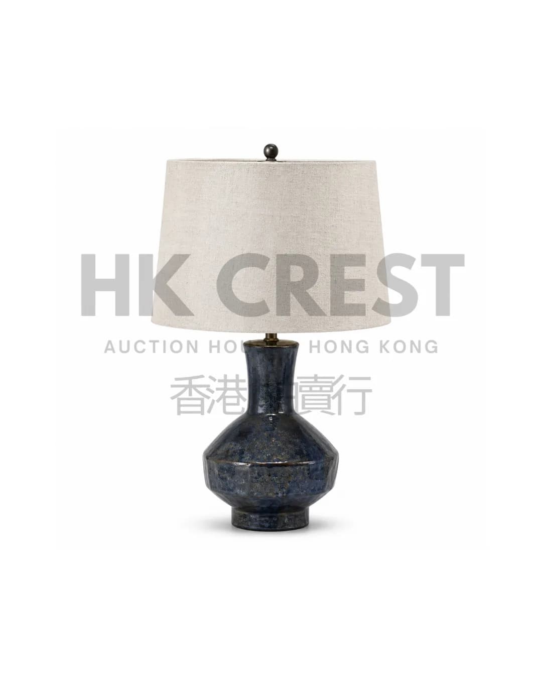 Ceramic table lamp with a dark ink-blue glazed base
