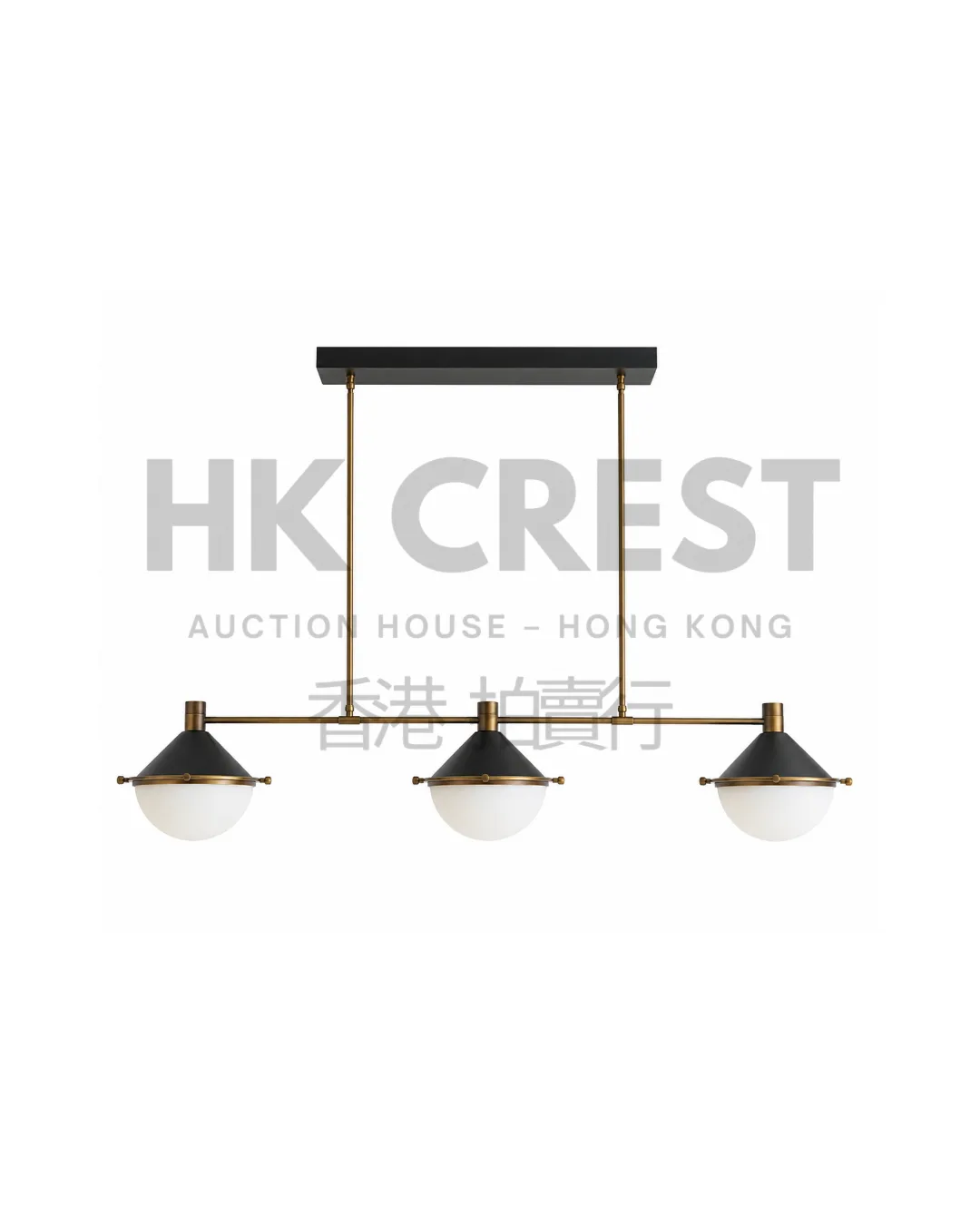 Opal glass pendant light composed of three spherical shades suspended from a blackened…