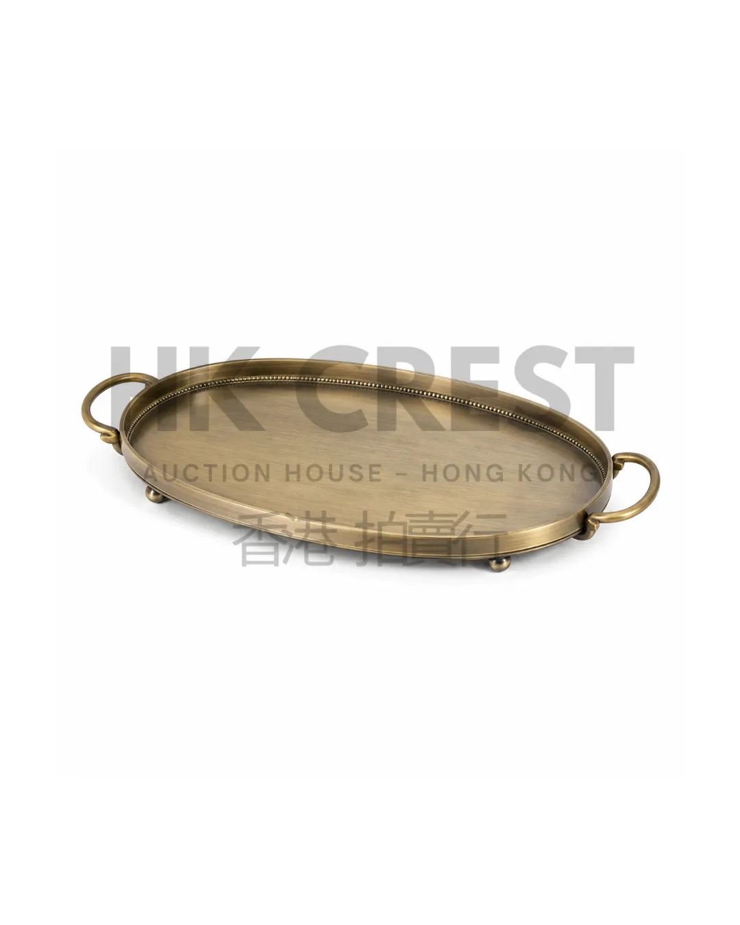 Brushed brass decorative tray of elongated oval form with a shallow raised rim and…