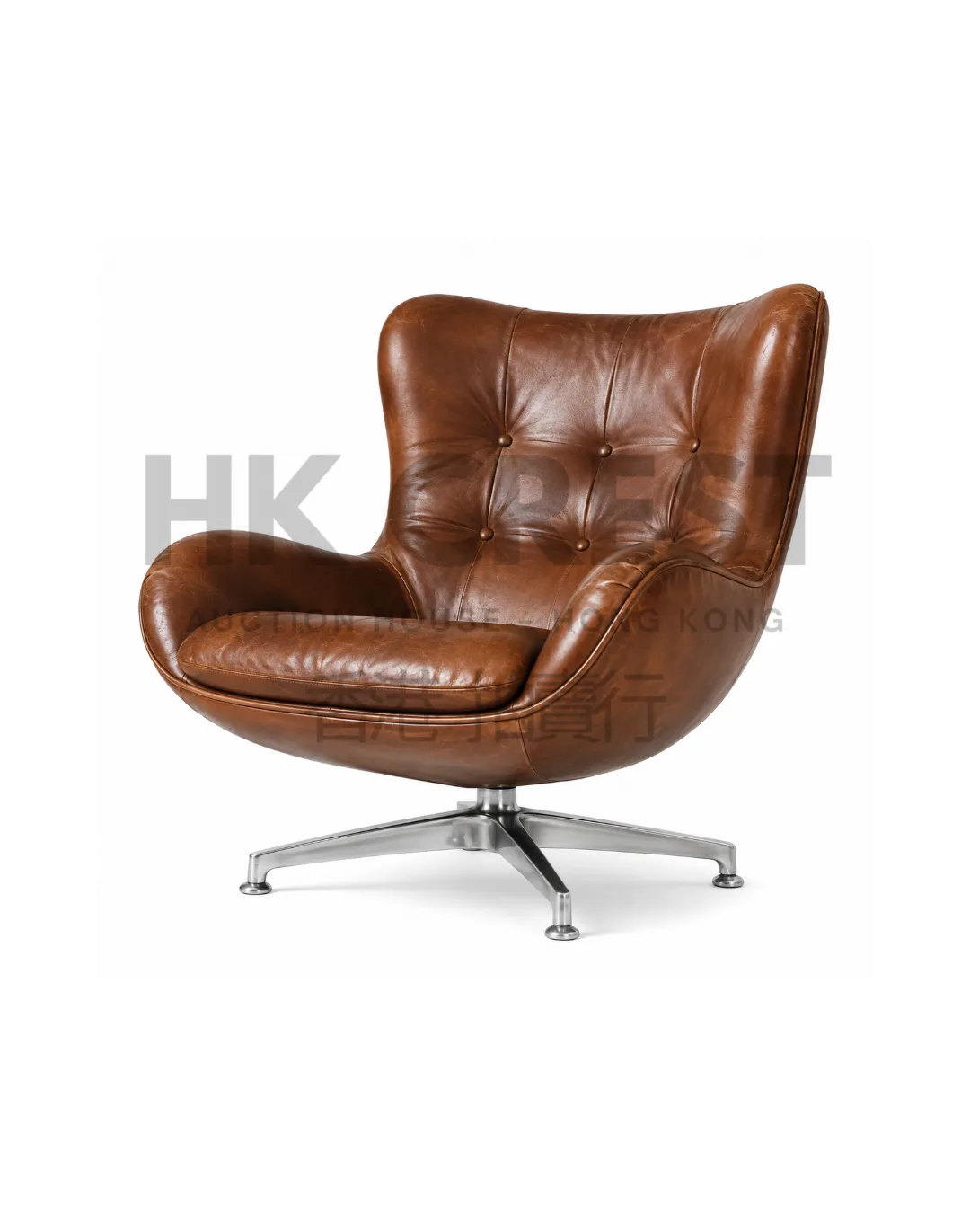 Swivel lounge chair upholstered in saddle-brown leather with a rounded bucket back and…