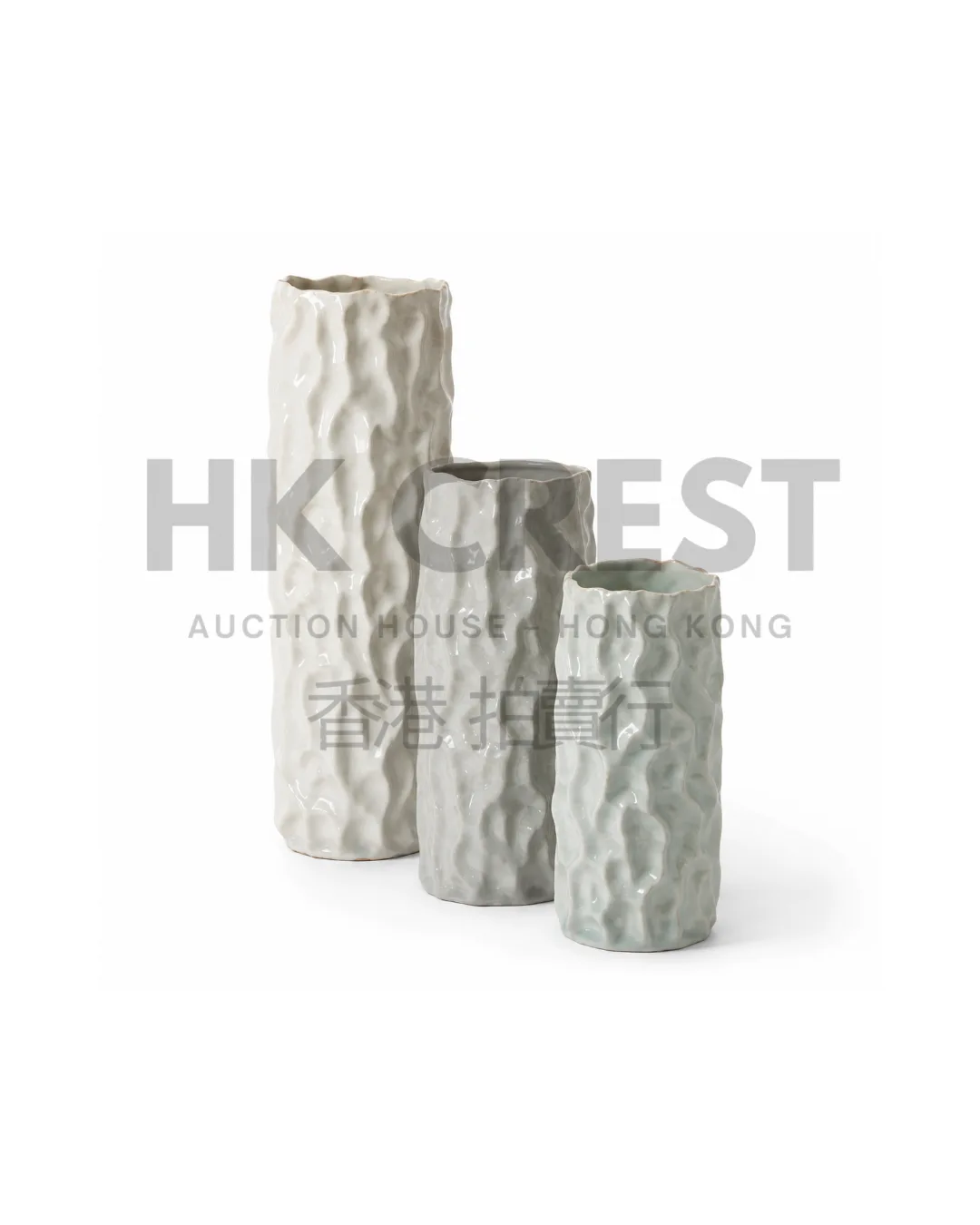 Set of three porcelain objects in graduated cylindrical forms, finished in white