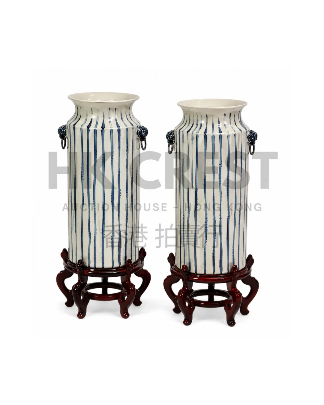 Pair of cylindrical porcelain vases with matte ivory glaze and fine vertical…